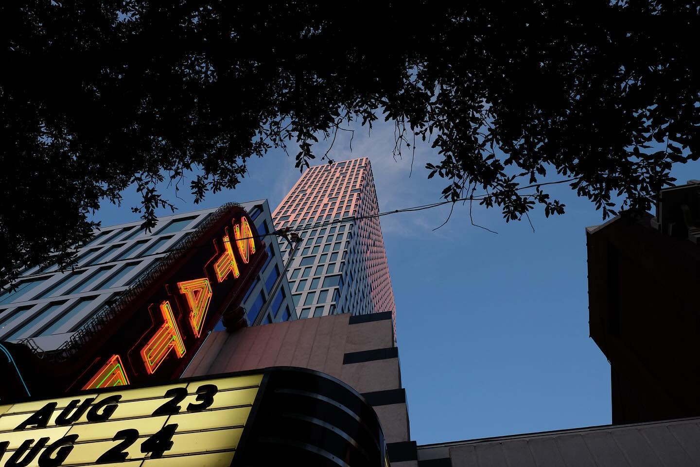 Theatre marquee beneath a tall tower